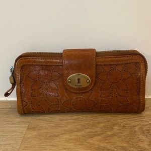 Fossil brown wallet with zippers and snap closure
